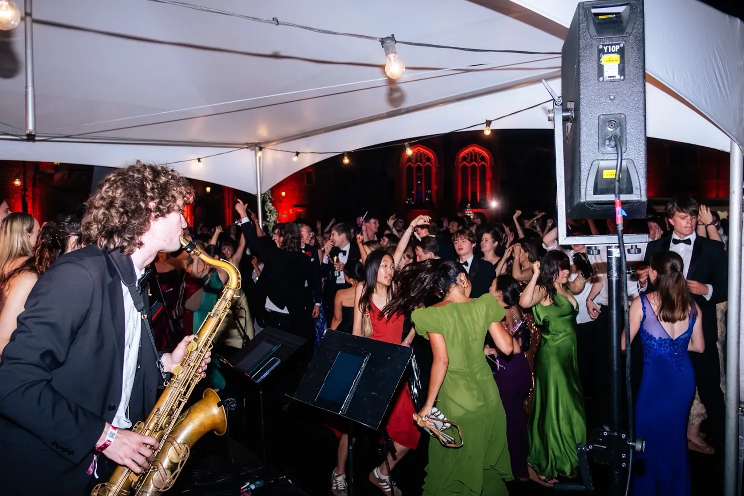 Callum playing the saxophone at Trinity Hall June Event in Cambridge
