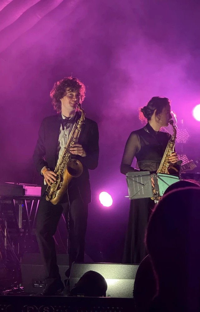 Callum playing sax at a Cambridge May Ball