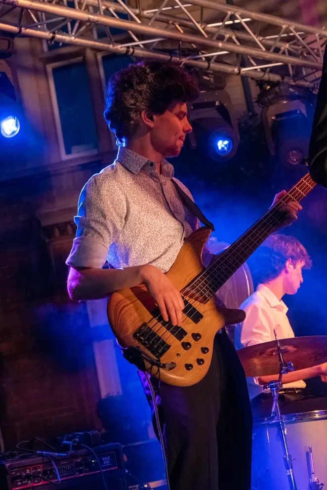 Peter playing bass on stage